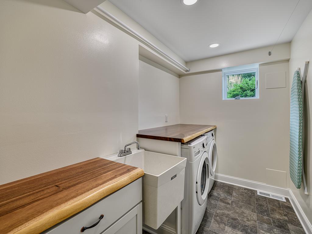 A freshly updated laundry room offers modern amenities and a clean, bright space