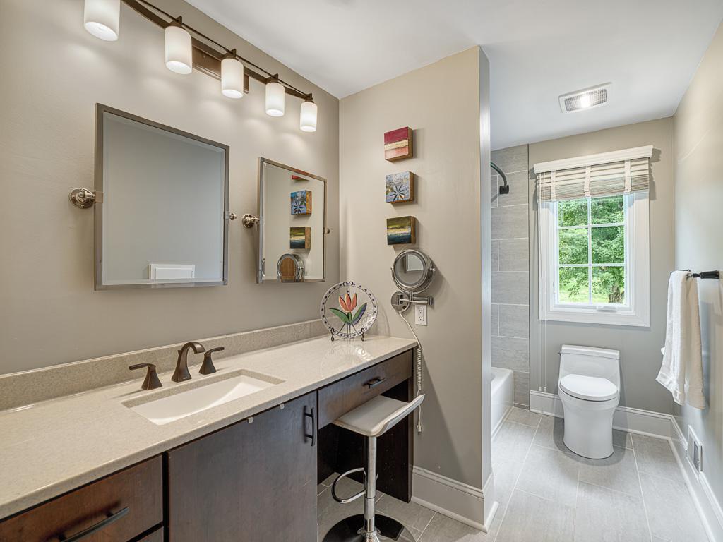The renovated full bath offers comfort and convenience with updated finishes and thoughtful design