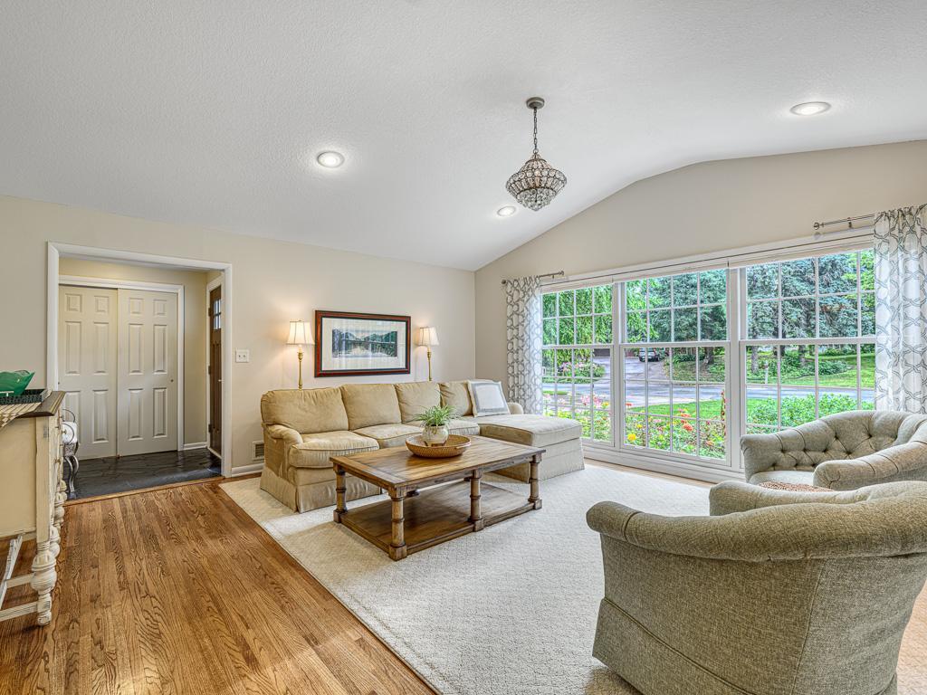 Step inside to the main level that impresses with vaulted ceilings and sun-filled spaces