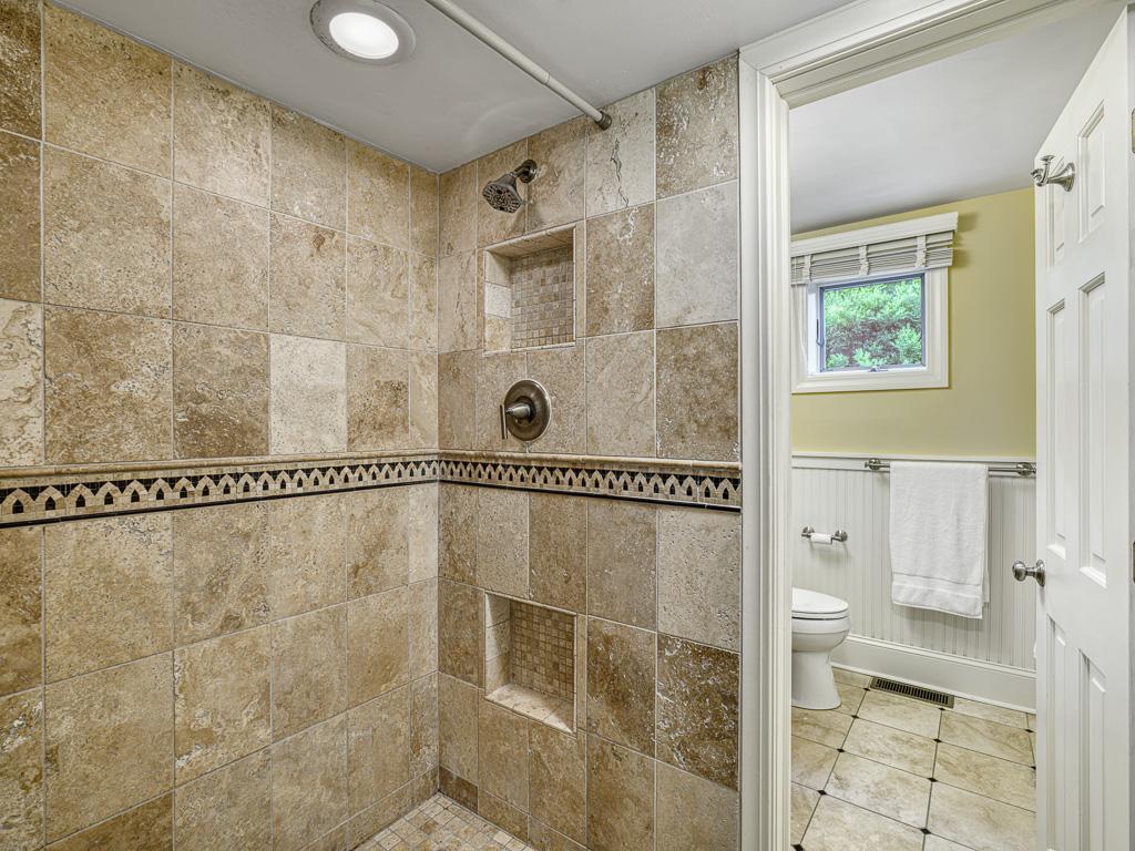 A beautifully tiled 3/4 bath is conveniently located on the lower level