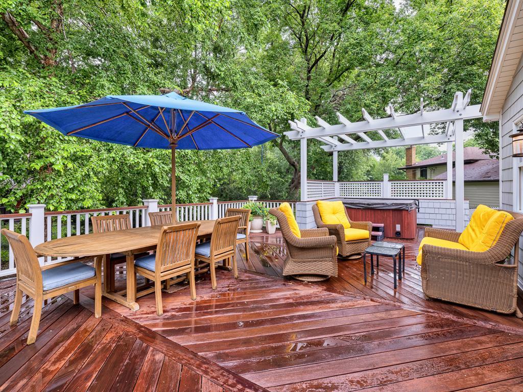 Enjoy the outdoors on a spacious Ipe deck complemented by a charming pergola