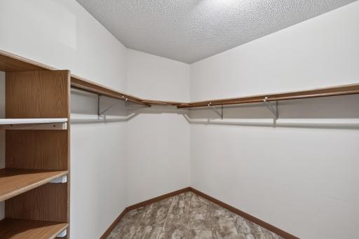 The walk-in closet in the primary bedroom is incredibly large! This space is sure to fit your entire wardrobe.