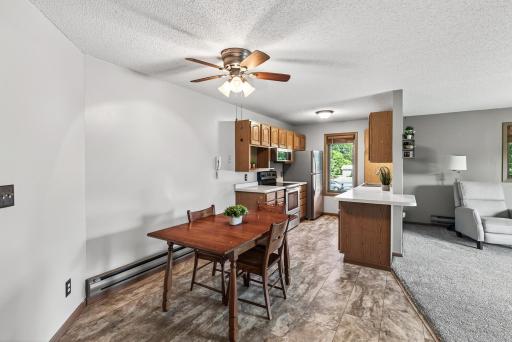 Here is an alternate view of the kitchen, dining room, and a peek into the living room.