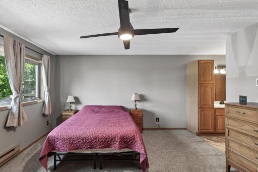 In this alternate view just to the right there is the vanity space and hallway that leads to the bathroom and walk-in closet.