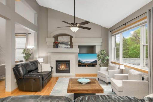Welcome to this INVITING home-beautiful amenities throughout! Sit back and relax and enjoy this great family room with a beautiful gas fireplace, vaulted ceiling, lots of windows with so much natural light, hardwood floors.