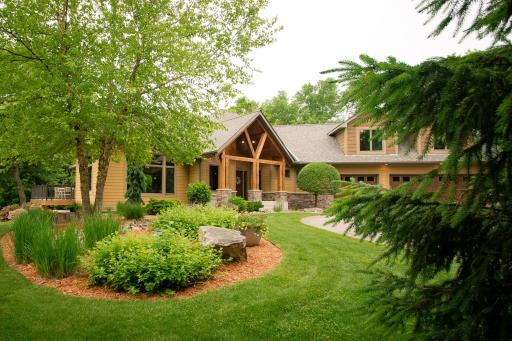 Landscaping includes perennials, accent rocks, trees, and more around entire home!