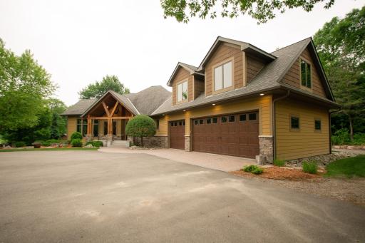 Oversized, insulated 3-car attached garage with back service door