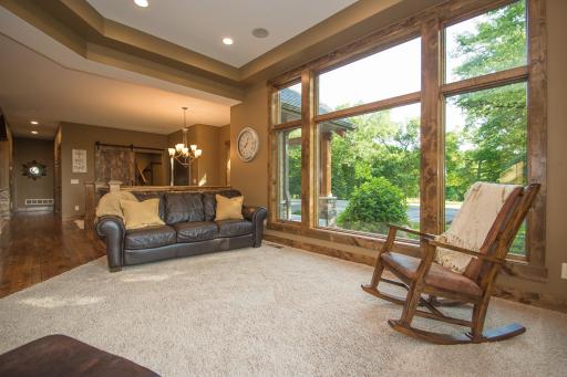 Open-concept main level with scraped hickory flooring and knotty alder trim