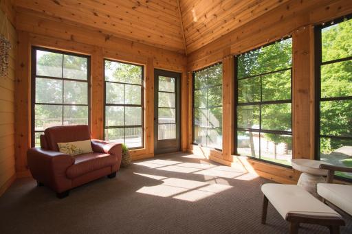 Cozy three-season porch walks out from informal dining