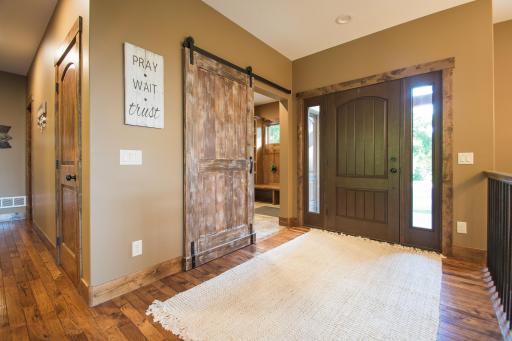 Spacious mud room off entry, leads to laundry, garage entrance, 3/4 bath and upper level