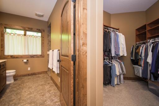 Large primary walk-in closet with built-ins