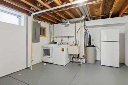 Fresh, clean, spacious Laundry and Storage Room.