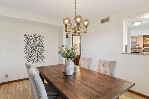 Spacious Dining opens to Kitchen and features an alcove for buffet/storage.