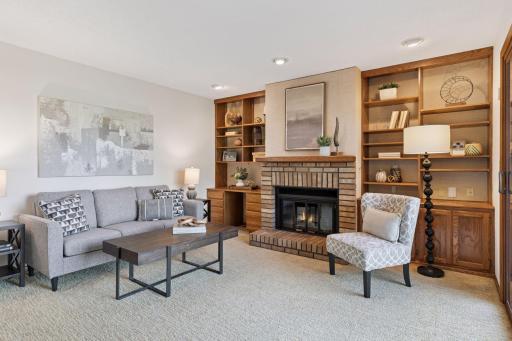 Main Level Family Room with gas burning fireplace, built-in storage and access to deck!