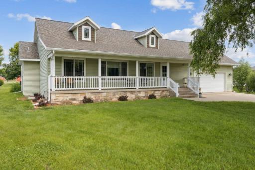 Welcome to 8142 Quail Court. This front porch is sure to be a relaxing spot for morning coffee or afternoon lemonade.