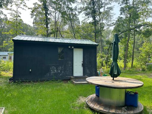 Great "camping" getaway location here just S of Garrison. This double lot is about an acre in size, and offers a cute little seasonal bunkhouse setup.