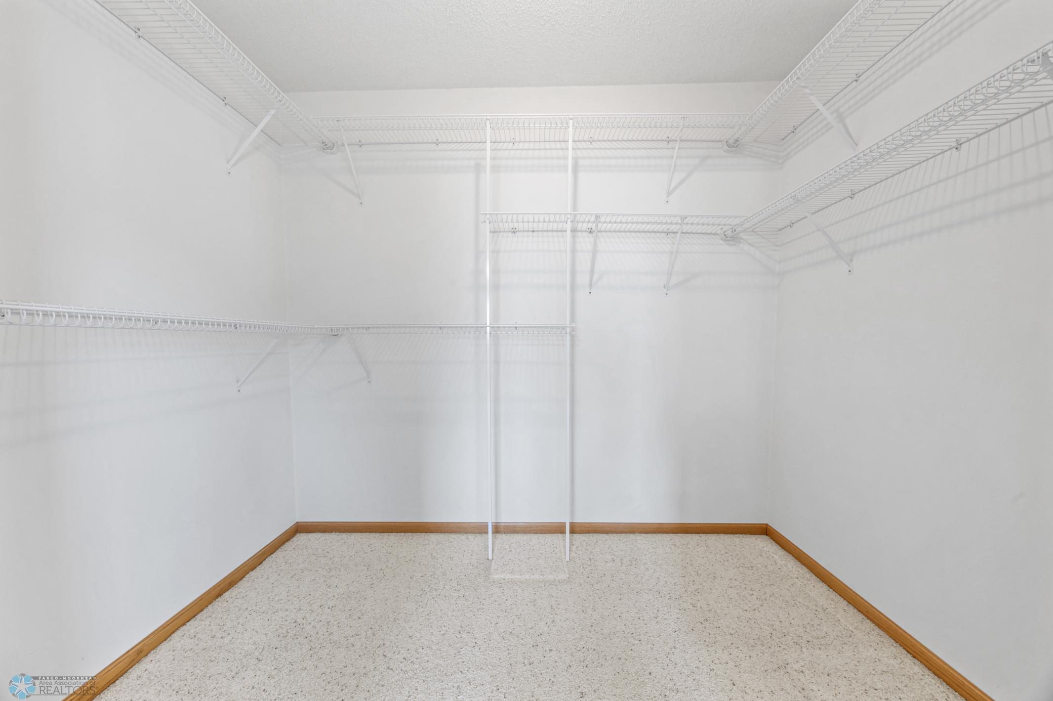 Storage galore! This is the primary bedroom's walk-in-closet.