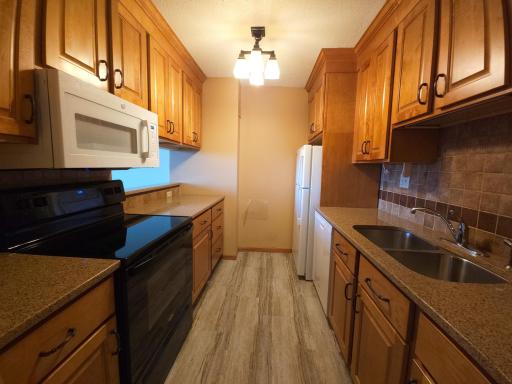 Updated kitchen with soft-close cabinets.