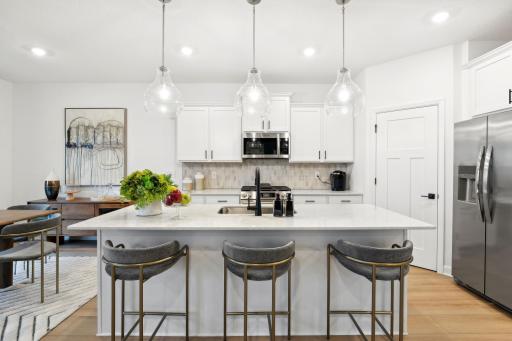 (Photo of model home, finishes will vary) The kitchen features brand-new appliances, ample cabinetry, designer-selected countertops and a pantry for added storage space.
