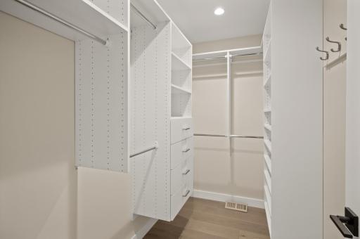 Sizeable primary closet with custom built ins!