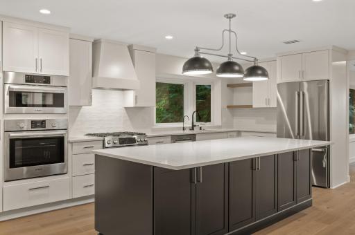 This stunning kitchen has marble countertops, soft close drawers and doors and Bosch appliances