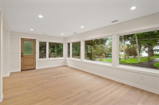 Expansive sunroom across front of house with stunning views of Lake Minnetonka!