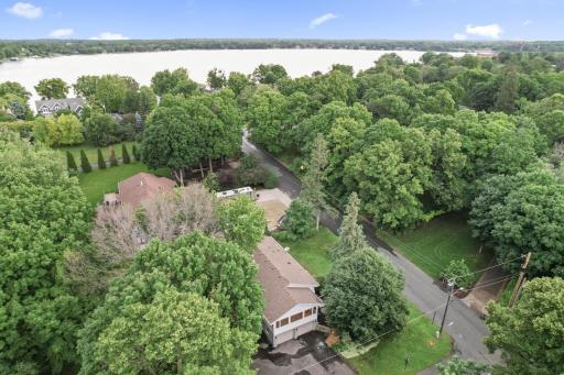 Aerial showing closeness to lake on north side of house