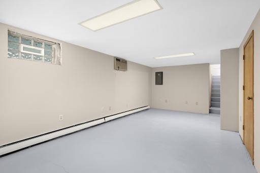 The lower level room has a walkout door to the backyard.