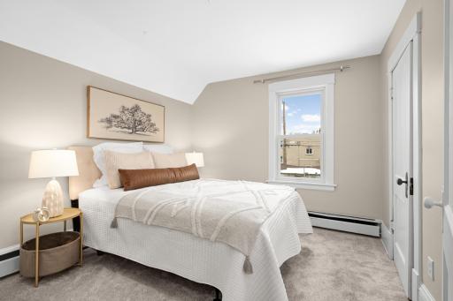 Upper level primary bedroom with new carpet.