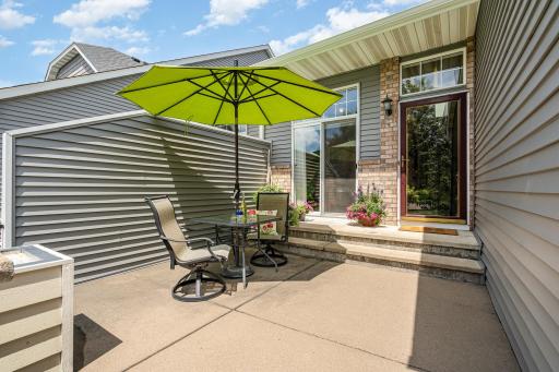 Charming front patio invites you to slow down and savor outdoor moments with space for dining, lounging, or container gardening.