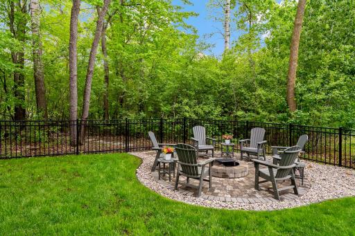 Step into the beautifully fenced yard featuring a professionally paved custom firepitâan ideal space for cozy evenings and outdoor gatherings. This thoughtfully designed outdoor area adds both charm and functionality to your private retreat.