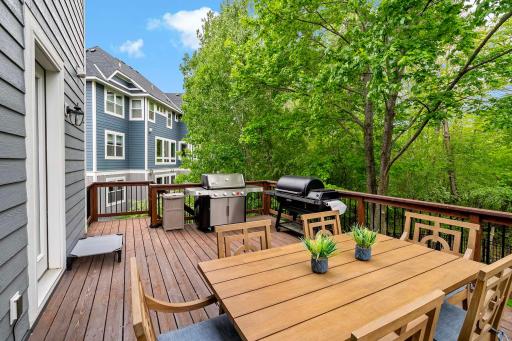 Step out onto the expansive deck, complete with wide steps that lead down to a private backyard backed by serene woodsâoffering the perfect blend of space, seclusion, and natural beauty.