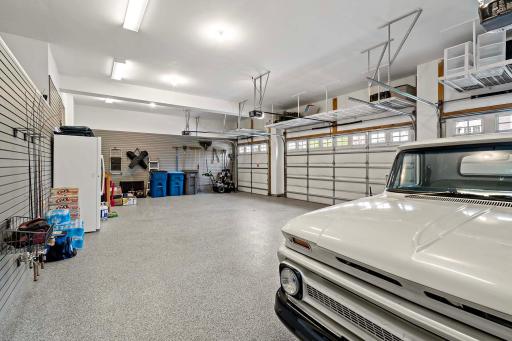 This spacious four-stall heated garage offers ample room for vehicles, storage, and hobbiesâproviding comfort and convenience year-round, no matter the weather.