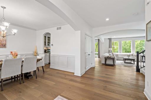 Step into an expansive entryway that sets the tone for the homeâs refined design, featuring Natural Elegance Broadleaf Collection engineered hardwood floors with sleek flush mount ventsâblending luxury, durability, and seamless style.