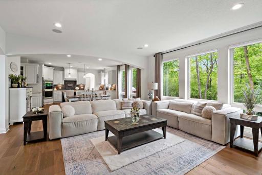 Take in the expansive view of the main level, where open-concept design meets high-end finishes. Seamless transitions between living, dining, and kitchen spaces create an ideal setting for both everyday living and entertaining.