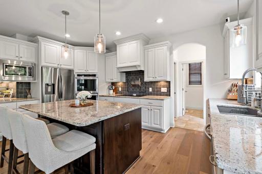 An alternative view of this high-end kitchen reveals a chefâs dreamâequipped with top-tier appliances, ample prep space, and thoughtful design details that make cooking and entertaining a true pleasure.