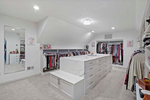 Prepare to be wowed by the most amazing closet youâve ever seenâfeaturing a stunning waterfall island, fully custom shelving throughout, and even a dedicated shoe wall. Every inch is designed with luxury, function, and fashion in mind.