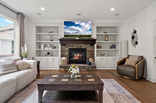 The main level living room offers a seamless entertainment experience with a CORE1 Entertainment & Automation Controller, Control4 Halo remote, Roku Ultra streaming device, and a WattBox IP power conditioner with OvrC Home for optimal performance.