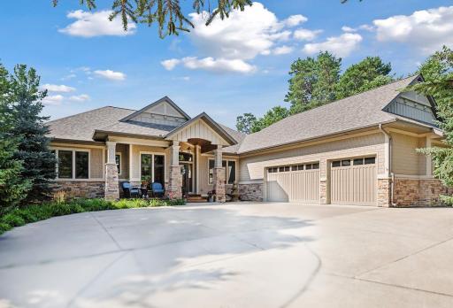 Nestled in a picturesque setting, this stunning home is surrounded by extensive landscaping that seamlessly blends natural beauty with thoughtful design, the landscape offers both beauty and tranquility, making it a true sanctuary for its inhabitants