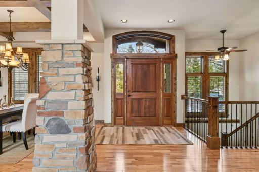 As you enter, youâre greeted by a grand open concept foyer and impressive living space with expansive vaulted ceilings and gracious room sized. The spaces are enhanced with elegantly crafted millwork and oversized windows.