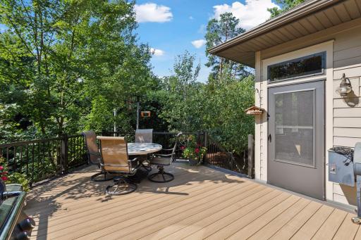 Hidden within the lush landscaping and a canopy of mature trees, the deck offers exceptional privacy.