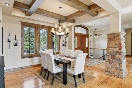 Rich hardwood floors flow seamlessly through the main living areas, beautifully accentuating the Alder millwork and cabinetry. This combination creates a warm and inviting decor that enhances the home's overall ambiance.