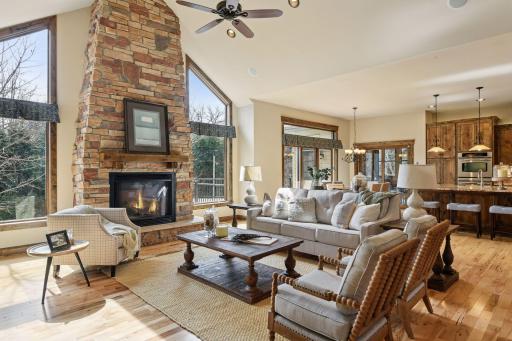 The home is designed to invite the outdoors in, featuring a large set of double windows that fill the staircase with natural light.
