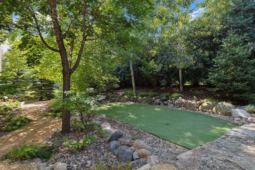 Conveniently located just off the walkout back patio, the practice putting green offers a playful yet sophisticated touch to the outdoor spaceâperfect for honing your swing or enjoying a friendly game with family and friends.