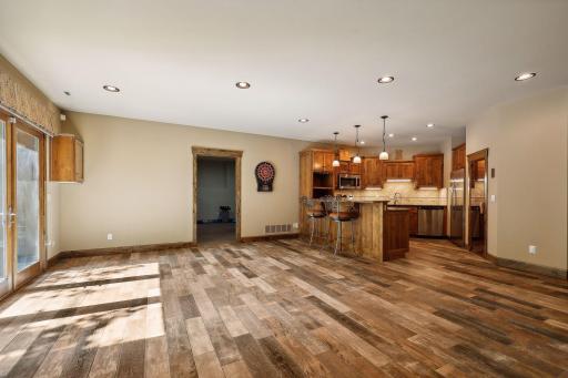 The durable and beautiful ceramic tiled floors add a sense of warmth to the lower level. And the lower level has heated floors.