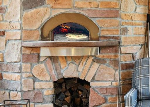 Much more than a pizza oven, this Italian imported wood fired oven offers a wonderfully savory world of open-hearth cooking, including meats, fish, vegetables, bread, even desserts.