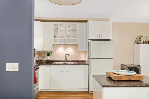 The undercabinet lighting is great for those early mornings and late nights. The glass cabinet in the kitchen is ready to showcase your favorite dishes.