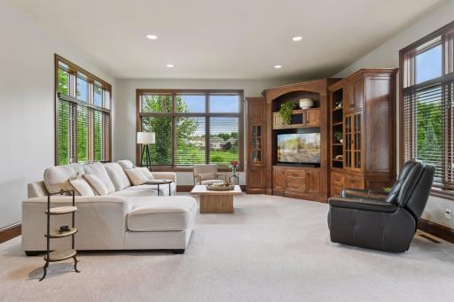 The Great room filled with light opens to the deck