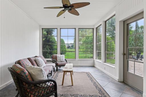 Screened porch overlooking park like yard