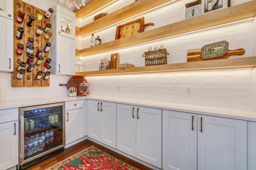 Butler's Pantry, Beverage Station featuring base to ceiling, subway tiled back-splash, open shelving and built in 'thirst' cooler.